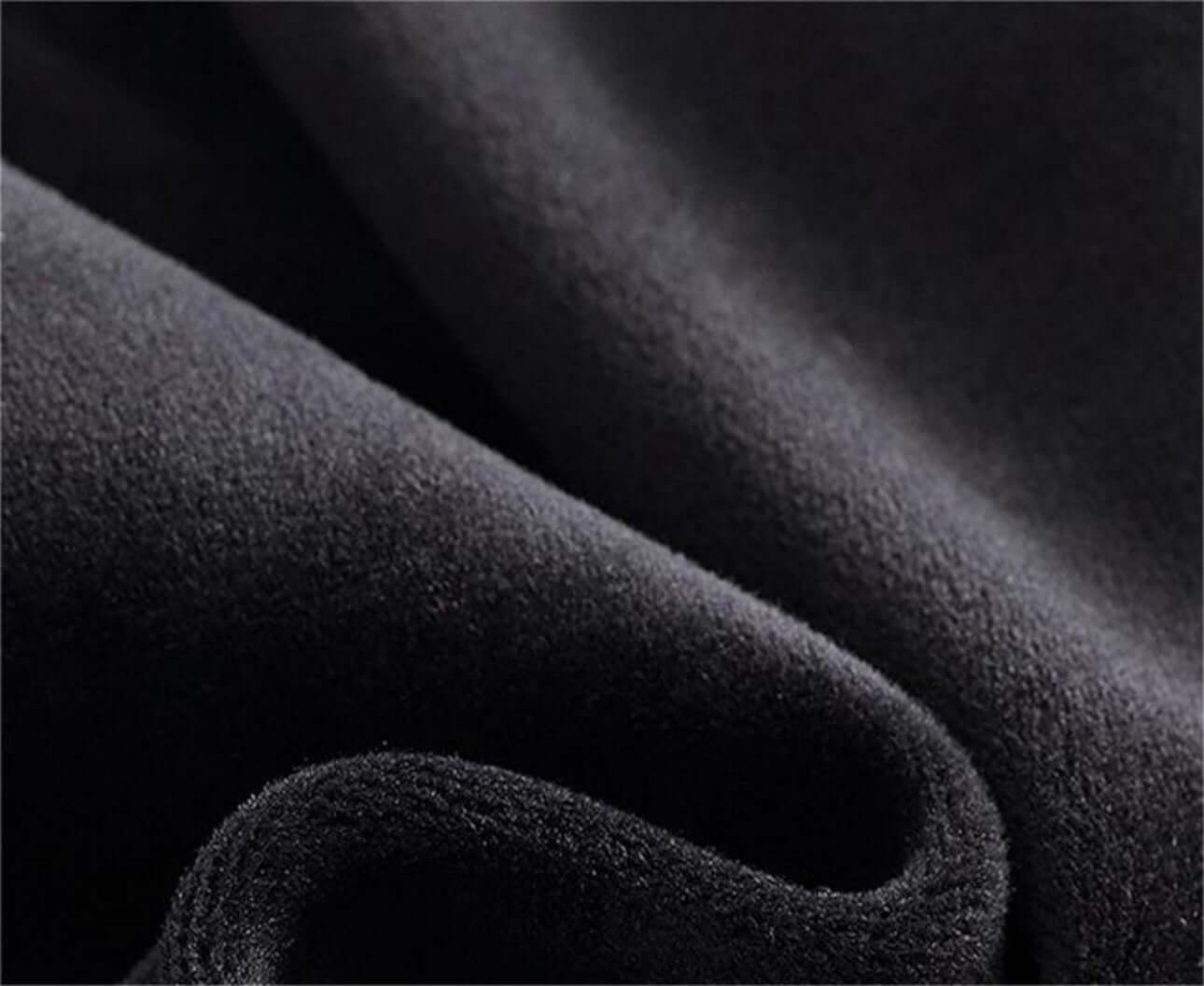 Close-up of soft black fabric, ideal for cold proof hat and gloves set production.