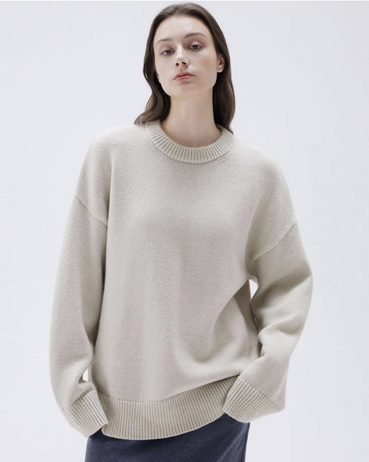 Front view of apricot cashmere sweater on female model