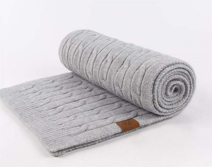Thick Cable-Knit Scarf OEM in gray, rolled up, showcasing premium thick knit texture, ideal for winter fashion.