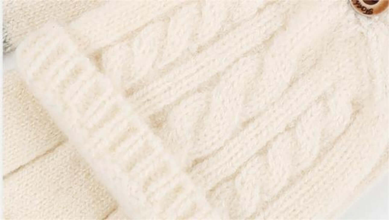 Flip Cap Fingerless Gloves OEM in soft cream knit with cable pattern and button detail.