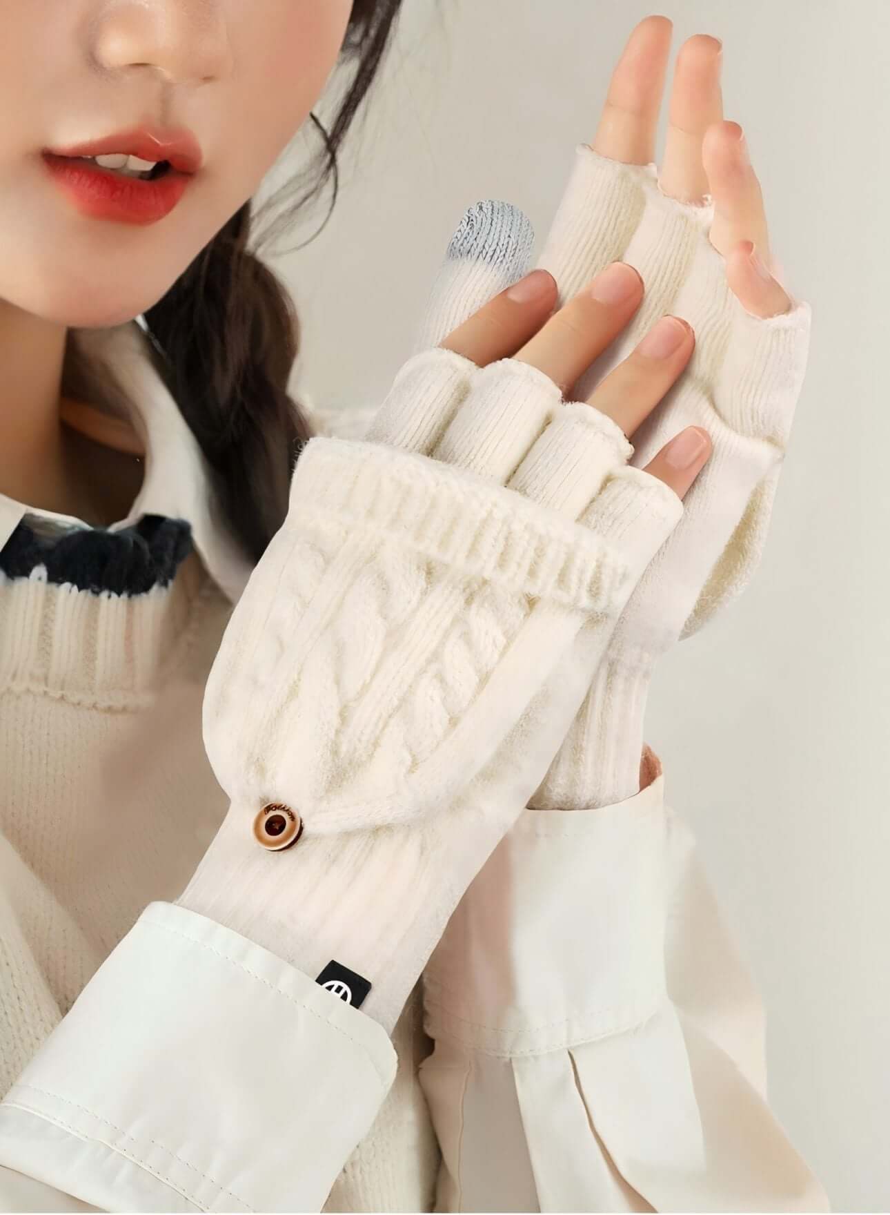Flip Cap Fingerless Gloves OEM in white, showcasing a model's hands with fleece lining and touchscreen capabilities.