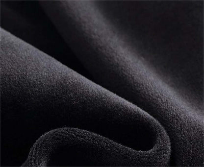 Close-up of soft black fabric, ideal for cold proof hat and gloves set production.