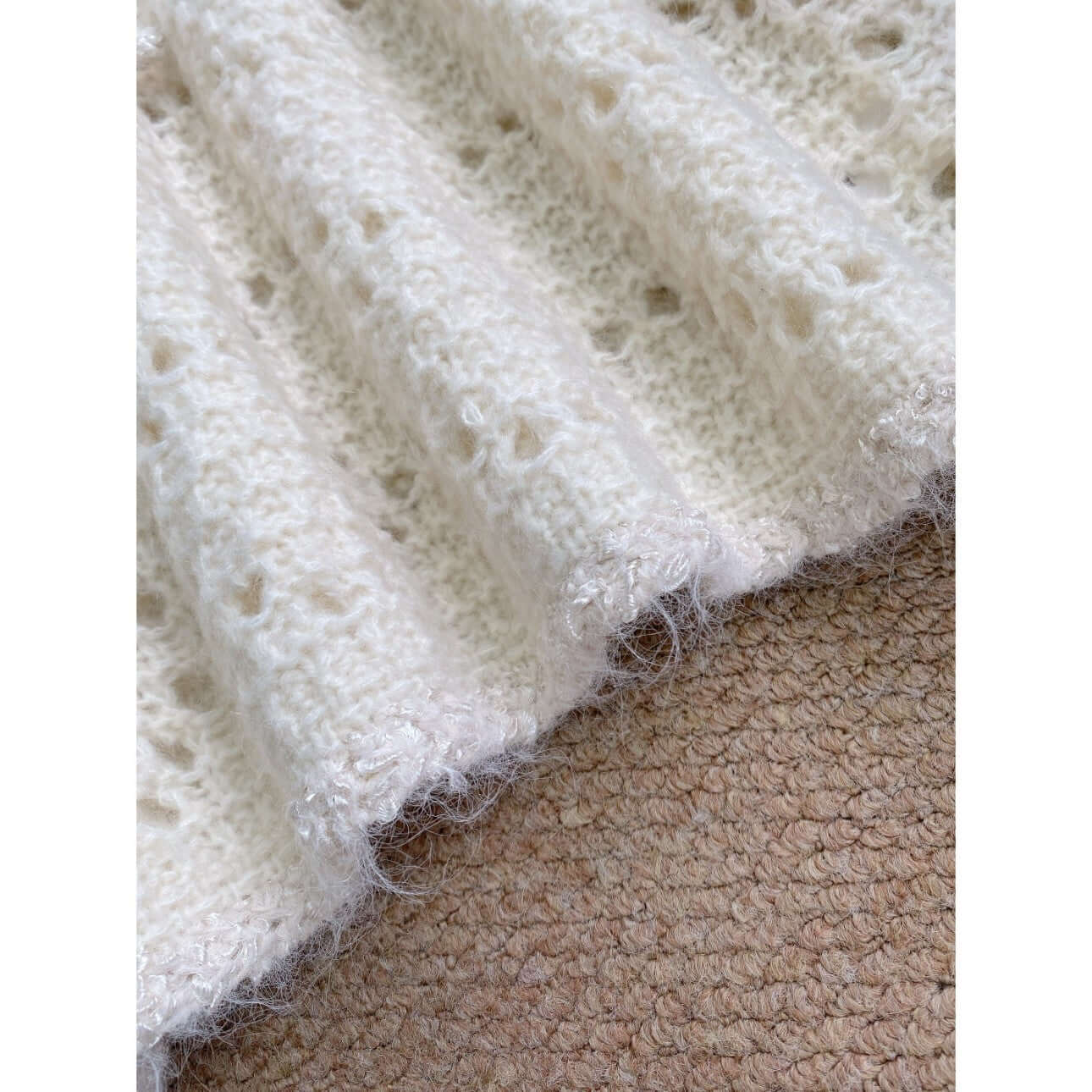 Crochet lace knit dress manufacturer close-up sparkling trim hem