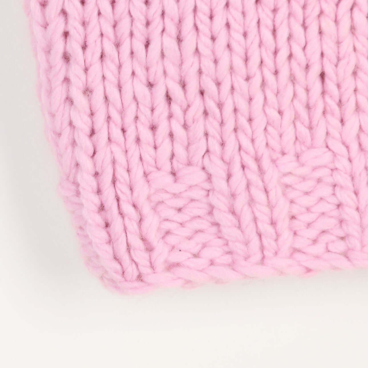 Hand knitted sleeveless top manufacturer close-up of neat hem finishing detail