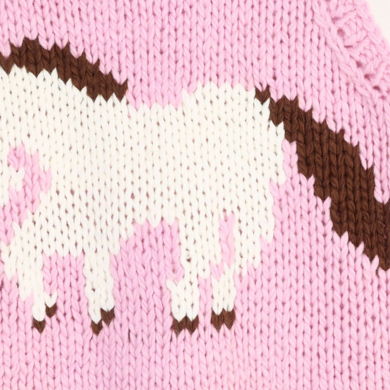 Hand knitted sleeveless top manufacturer close-up of front intarsia pony motif