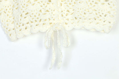 Close-up of a white hand crochet sleeveless top with adjustable drawstring detail, showcasing craftsmanship by Hand Crochet Sleeveless Top Manufacturer.