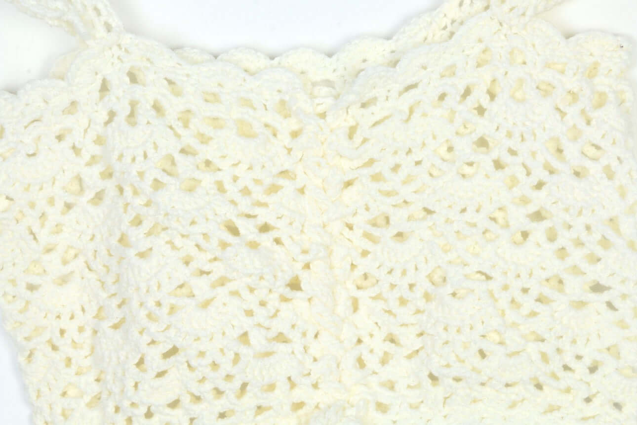 Hand Crochet Sleeveless Top Manufacturer - Close-up of intricate crochet pattern in cream color.