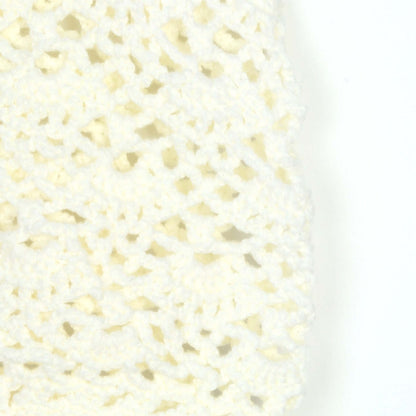 Close-up of a hand-crocheted sleeveless top by Hand Crochet Sleeveless Top Manufacturer in a cream color.