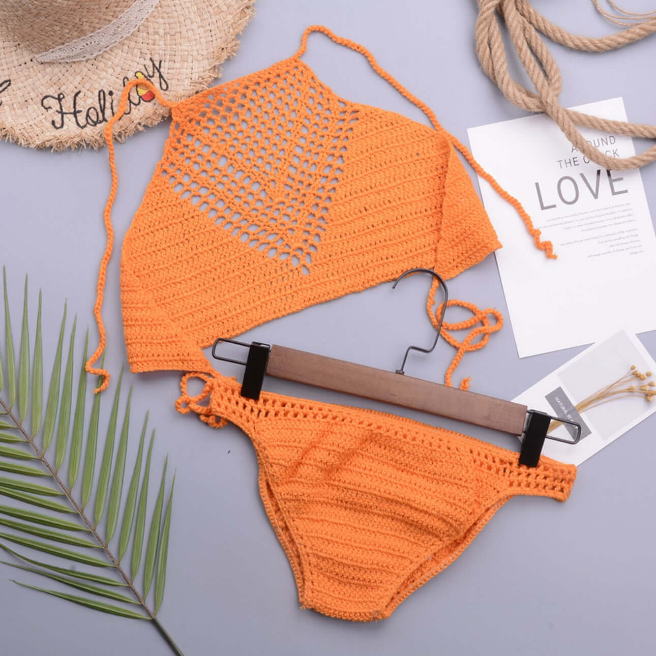 Orange hand crochet bikini set flat lay private label