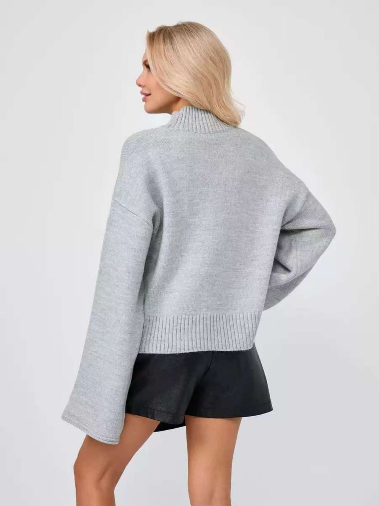 Back view of a women's Bell Sleeve Sweater in gray, featuring a mid neck and flared cuffs, perfect for stylish layering.