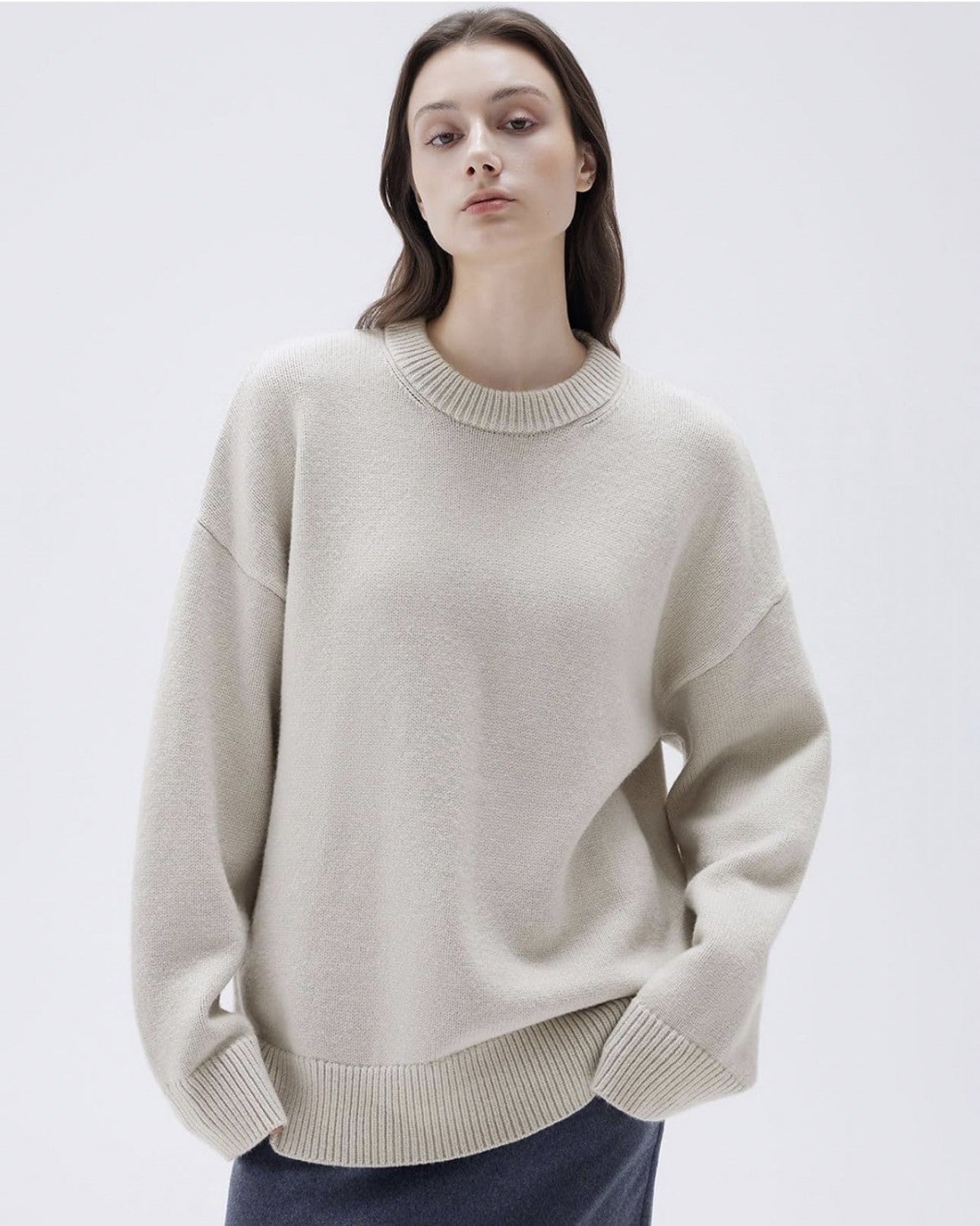 Front view of apricot cashmere sweater on female model