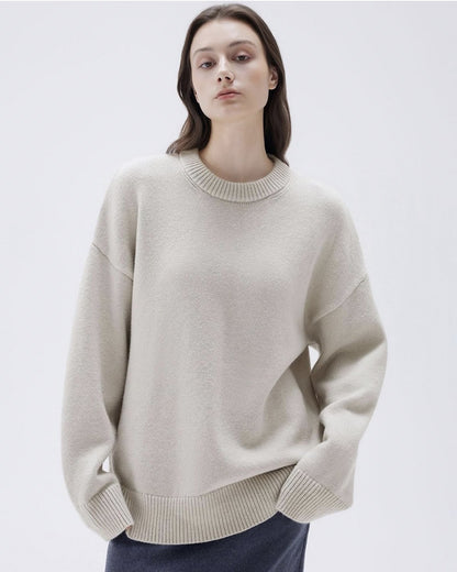 Front view of apricot cashmere sweater on female model