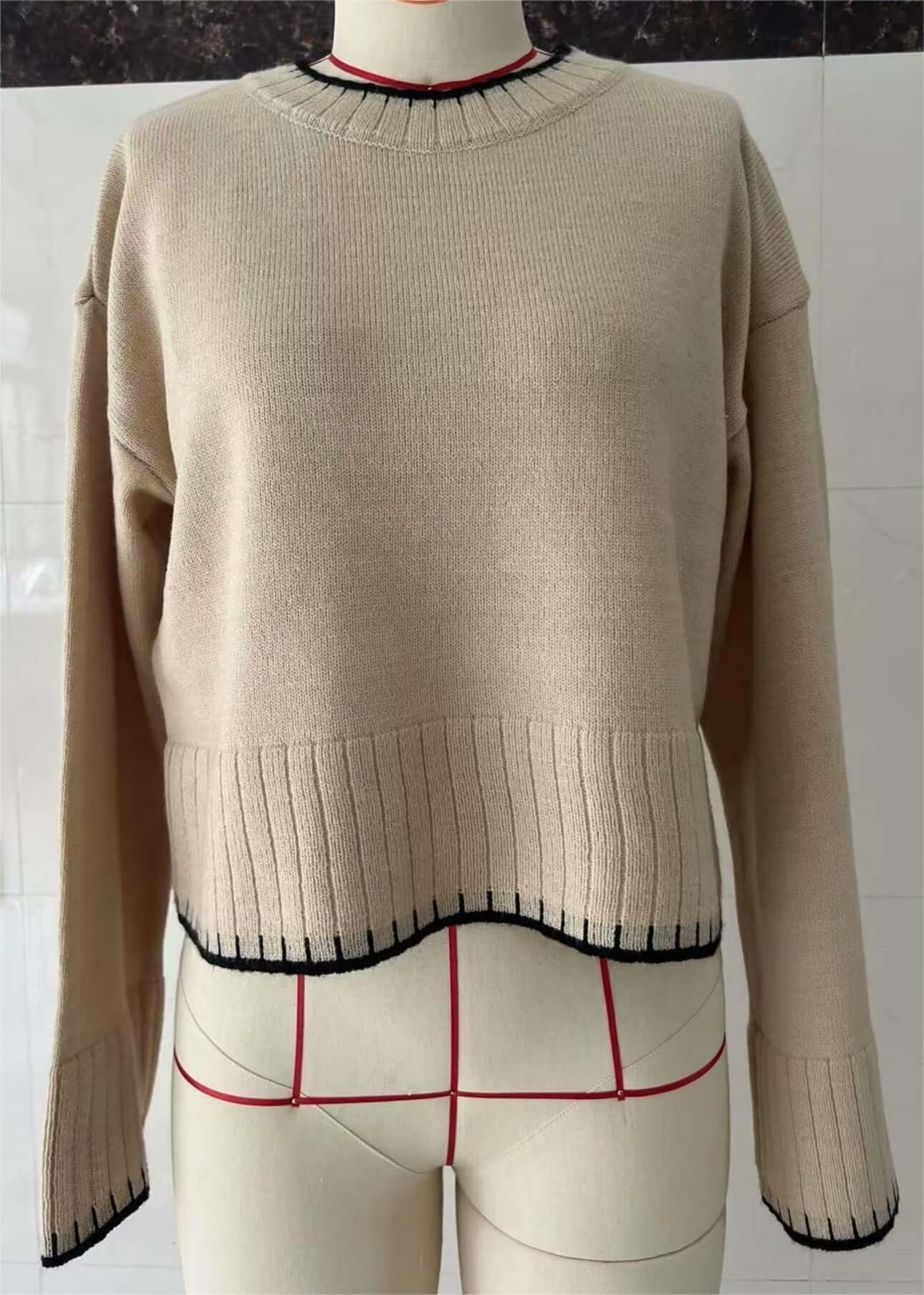 Cropped Loose Sweater OEM - Women's beige pullover with black trim, showcasing knit texture and contemporary design.