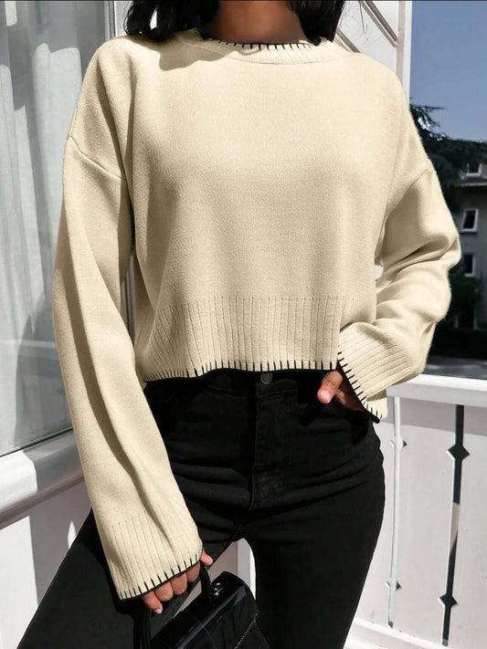 Cropped Loose Sweater OEM - Women's light beige pullover with black trim and long sleeves, perfect for a relaxed look.