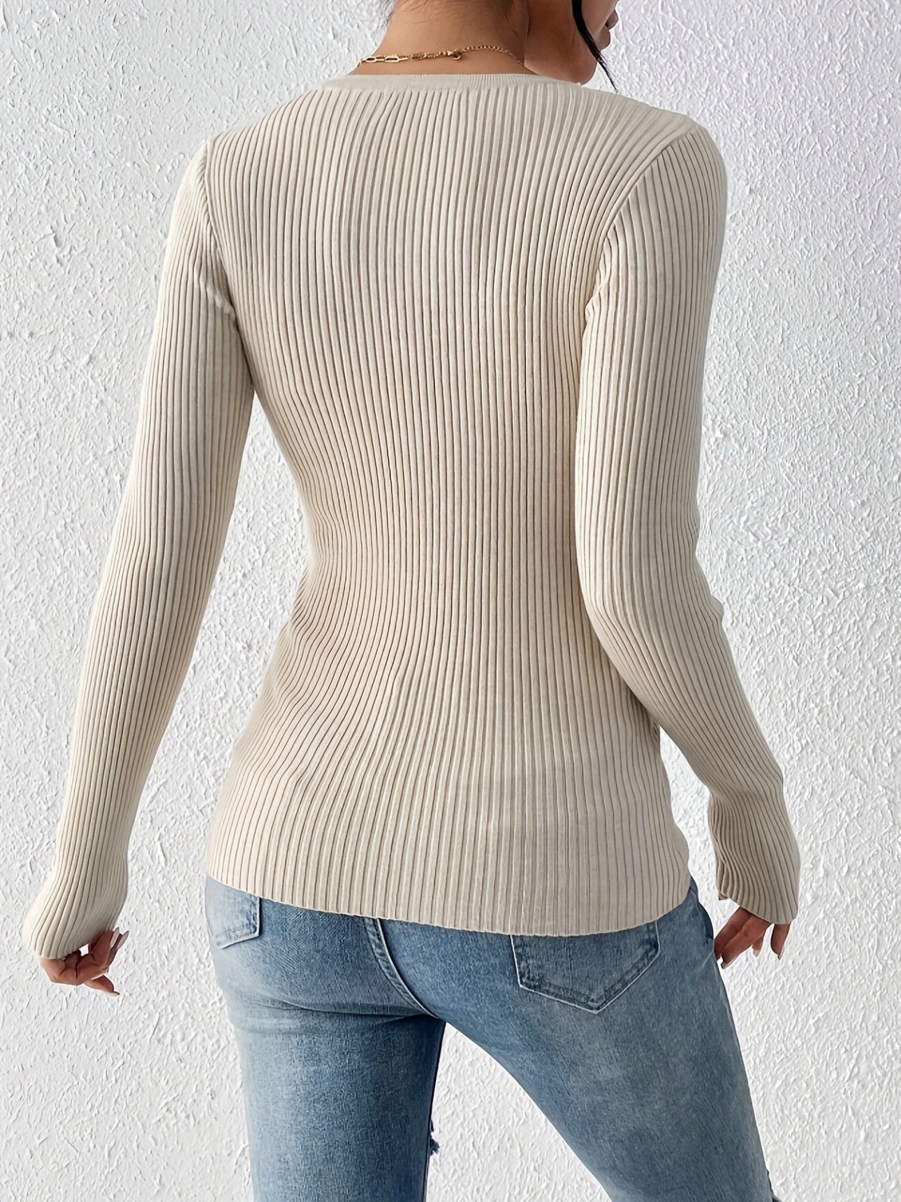 Back view of apricot fitted sweater showing tailored fit