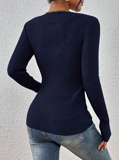 Back view of navy fitted sweater on model