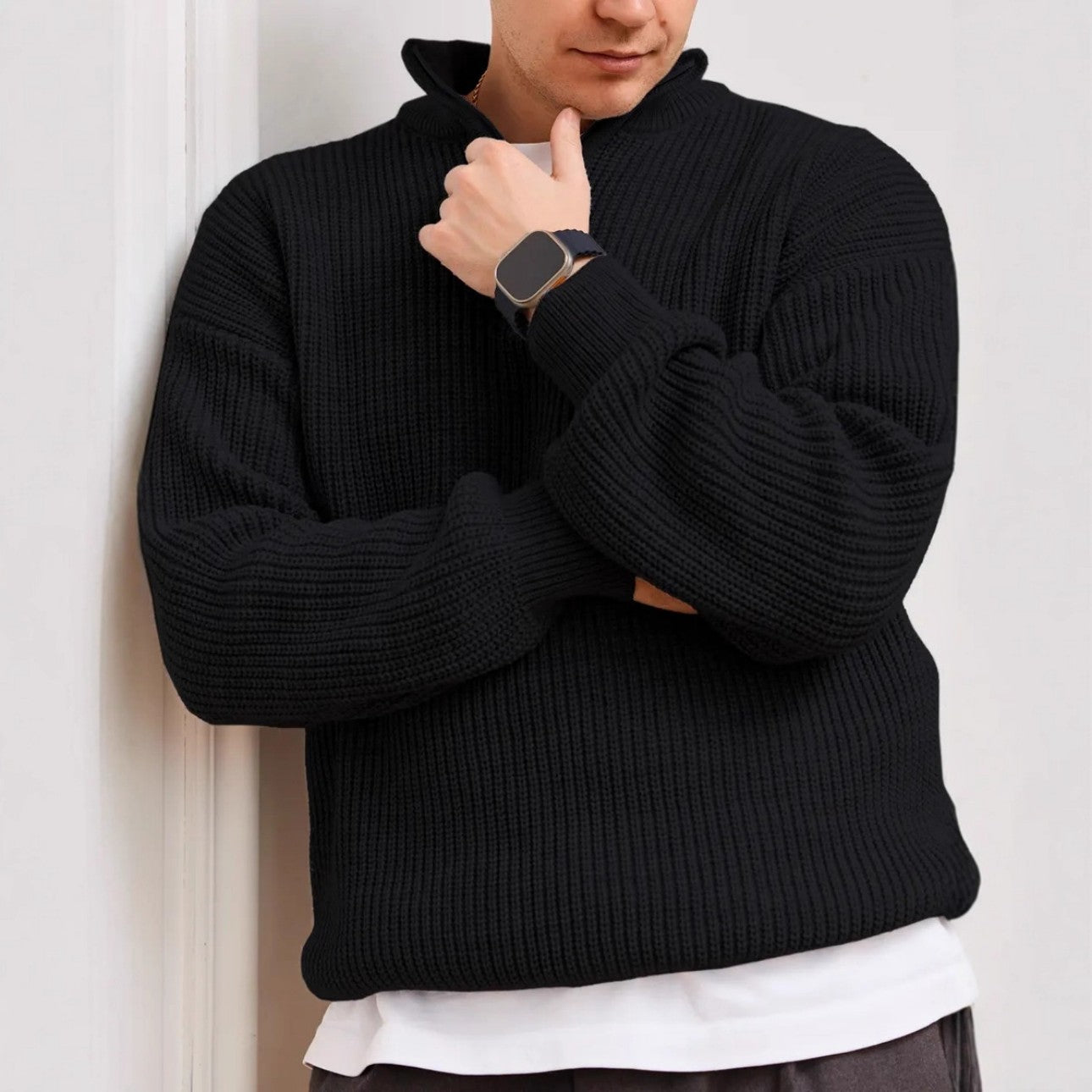Front view of black half zip sweater on man