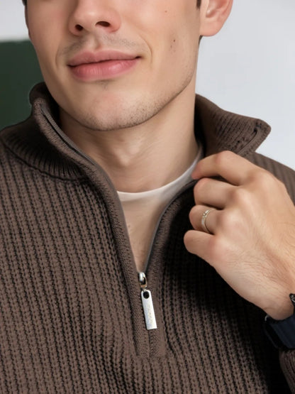 Close-up detail of stand collar and zipper on coffee half zip sweater