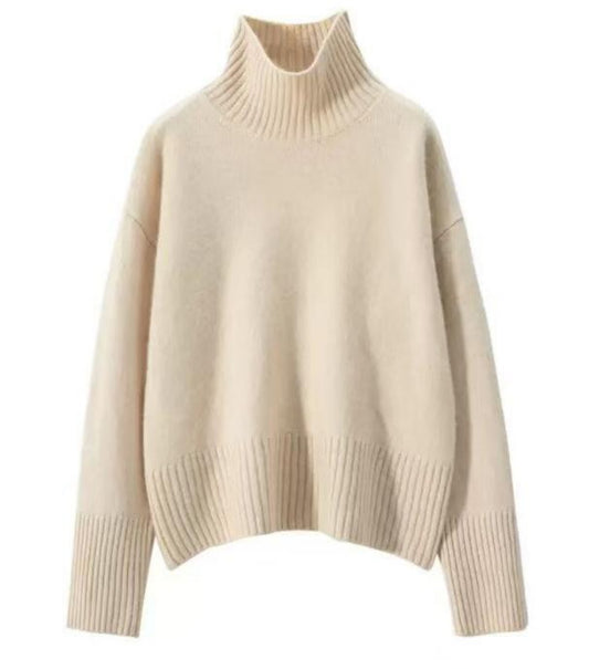 Flat lay detail of apricot high neck sweater