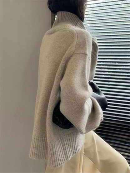 Side view of model in apricot high neck sweater