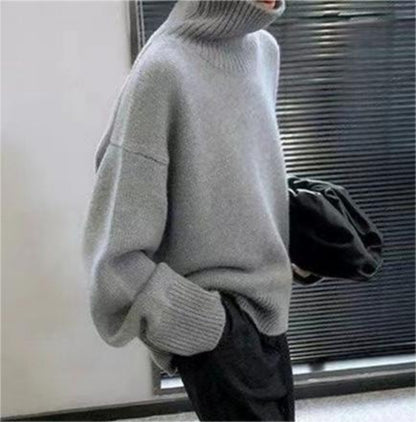 Side profile of woman wearing gray high neck sweater