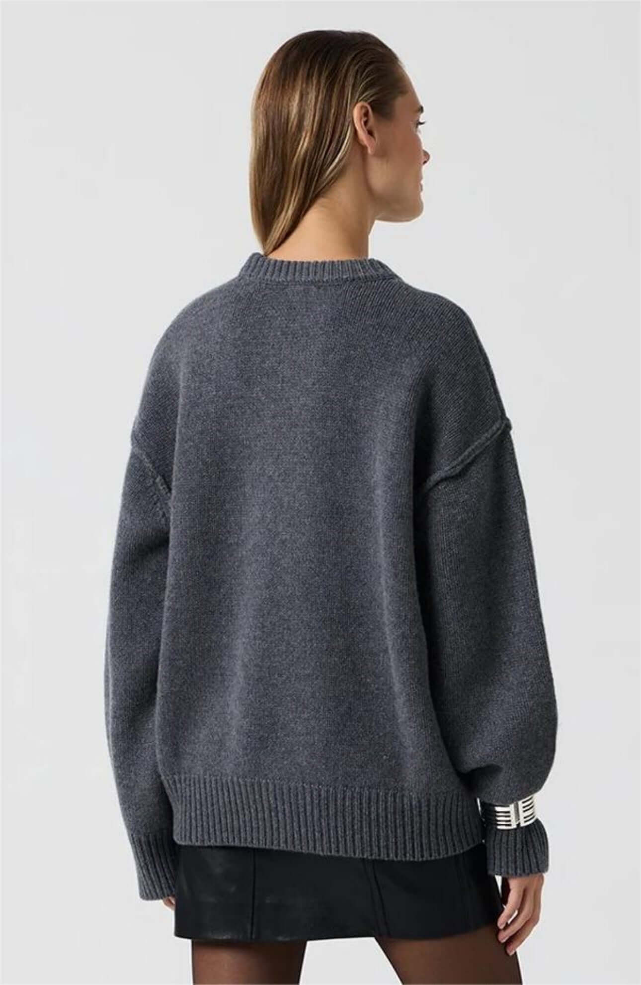Back view of blue gray long sleeve round neck sweater.