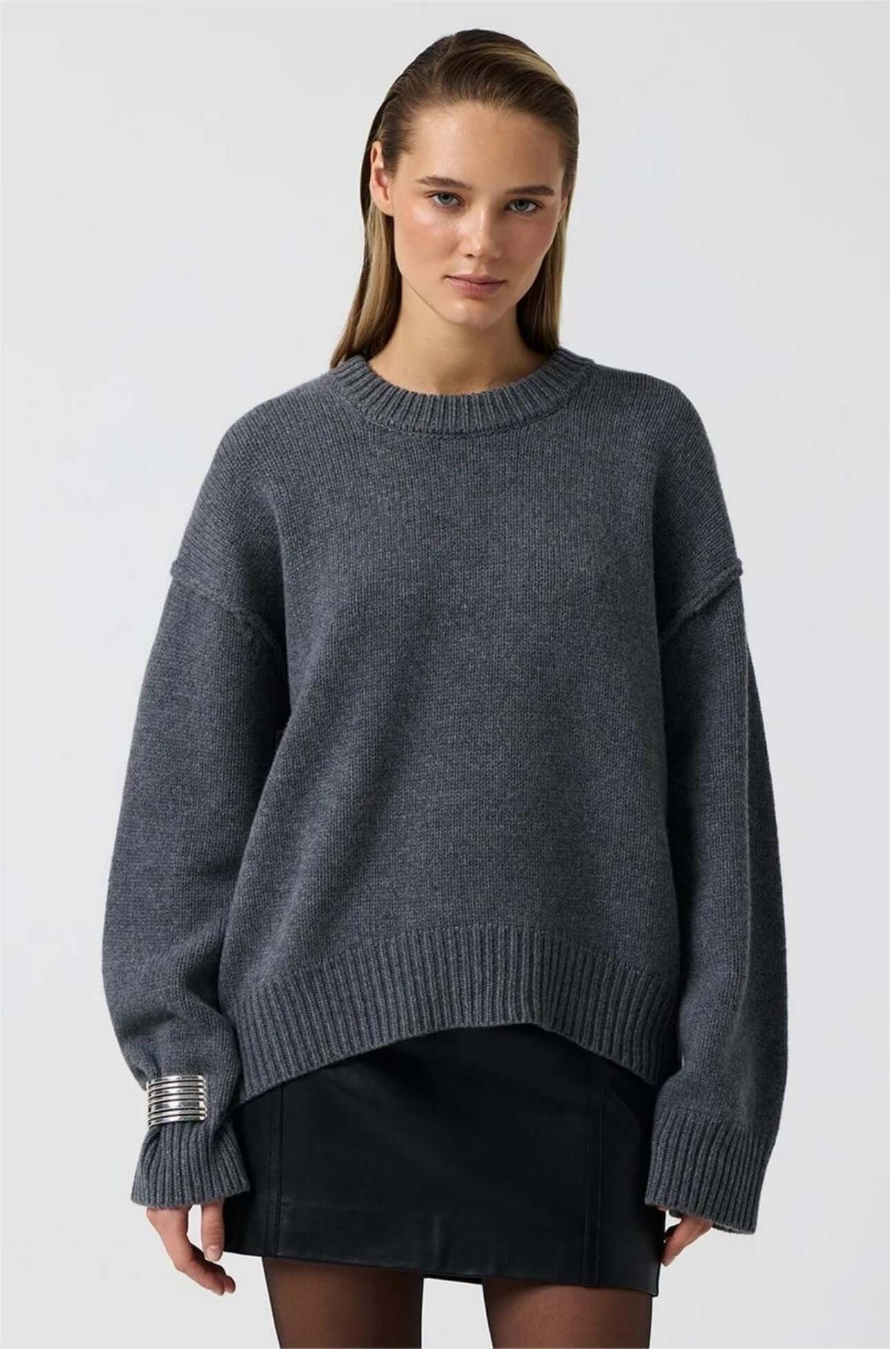 Blue gray long sleeve round neck sweater on model, front view.