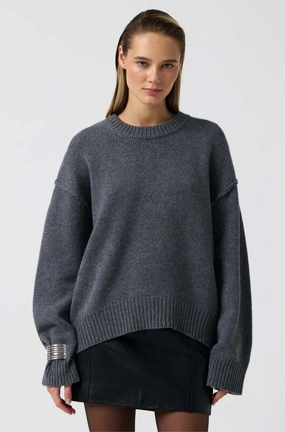 Blue gray long sleeve round neck sweater on model, front view.