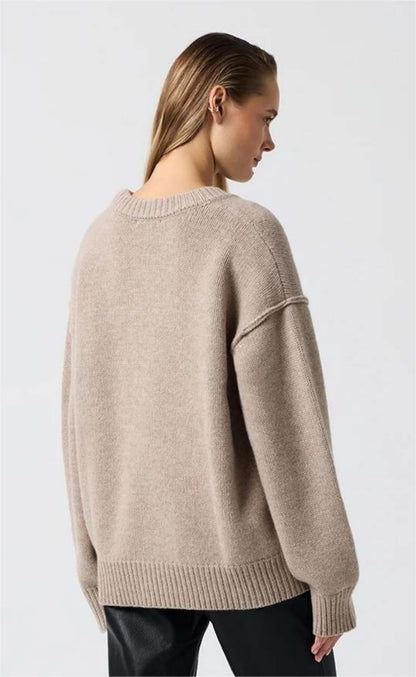 Back view of wheat long sleeve round neck sweater on model.