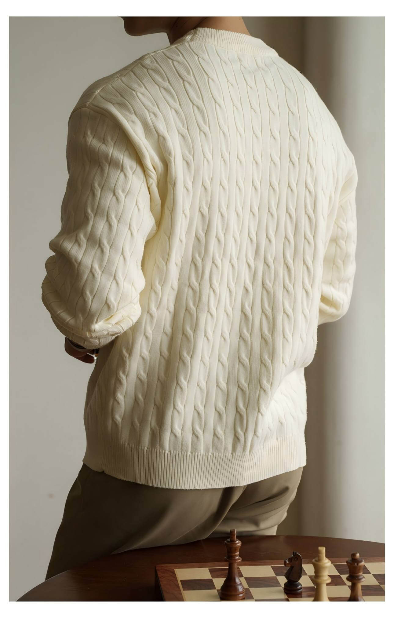 Men's Cable Knit Sweater OEM in creamy white, showcasing a classic Aran style design, perfect for stylish layering.