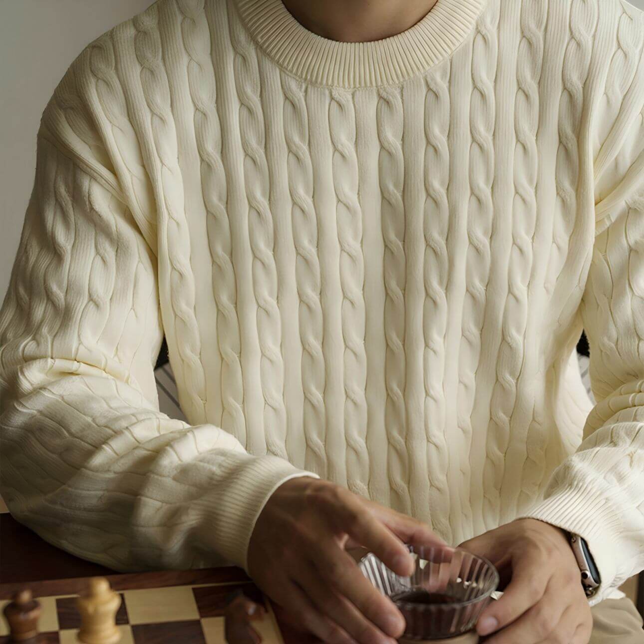 Men's Cable Knit Sweater OEM in a soft ivory color, featuring traditional Aran patterns, perfect for stylish casual wear.
