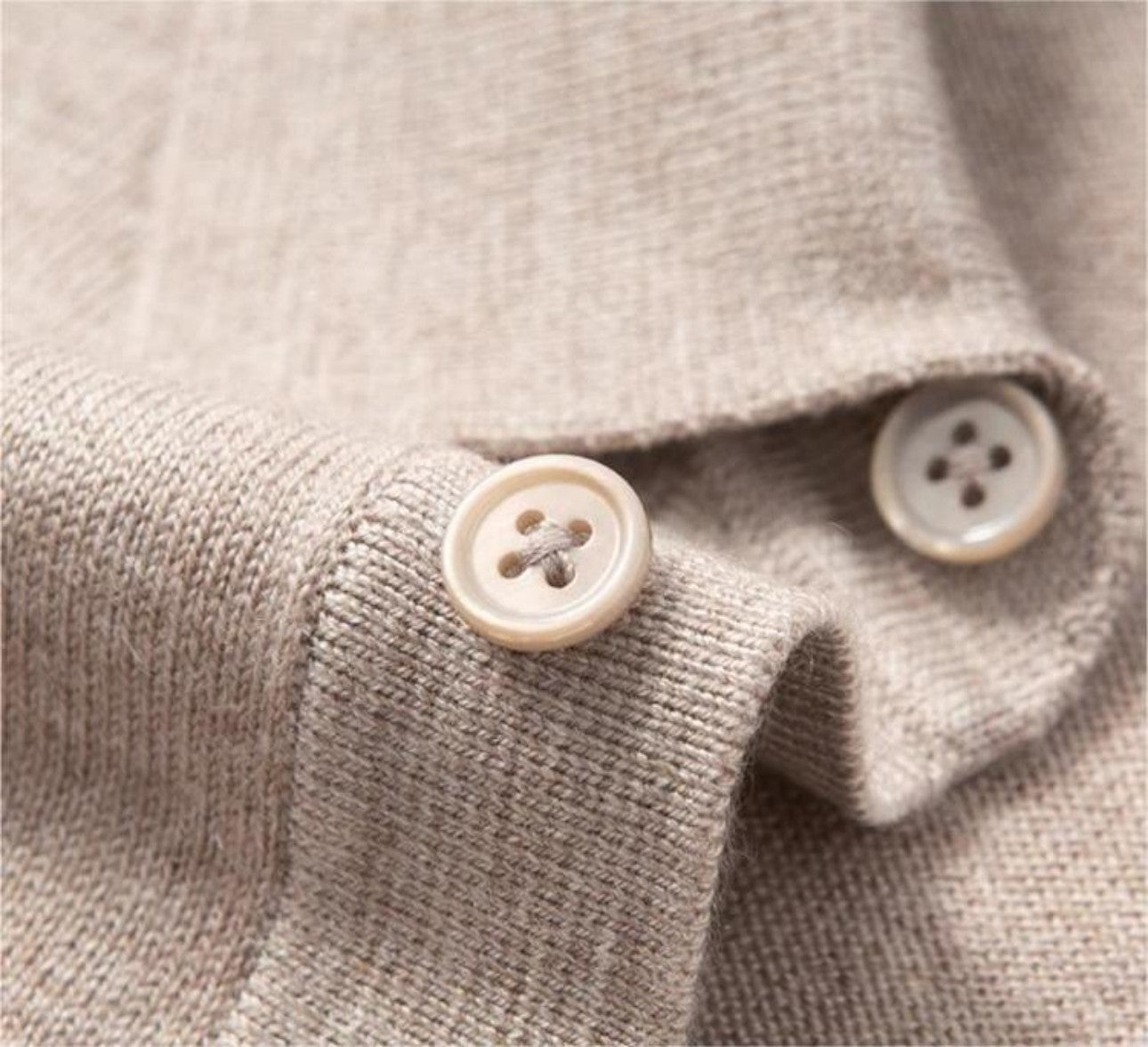 Three matching color buttons on polo sweater placket