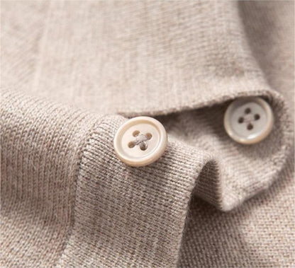 Three matching color buttons on polo sweater placket