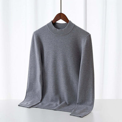Men's Wool Sweater OEM - Thick round-neck grey wool sweater displayed on a hanger against a light background.
