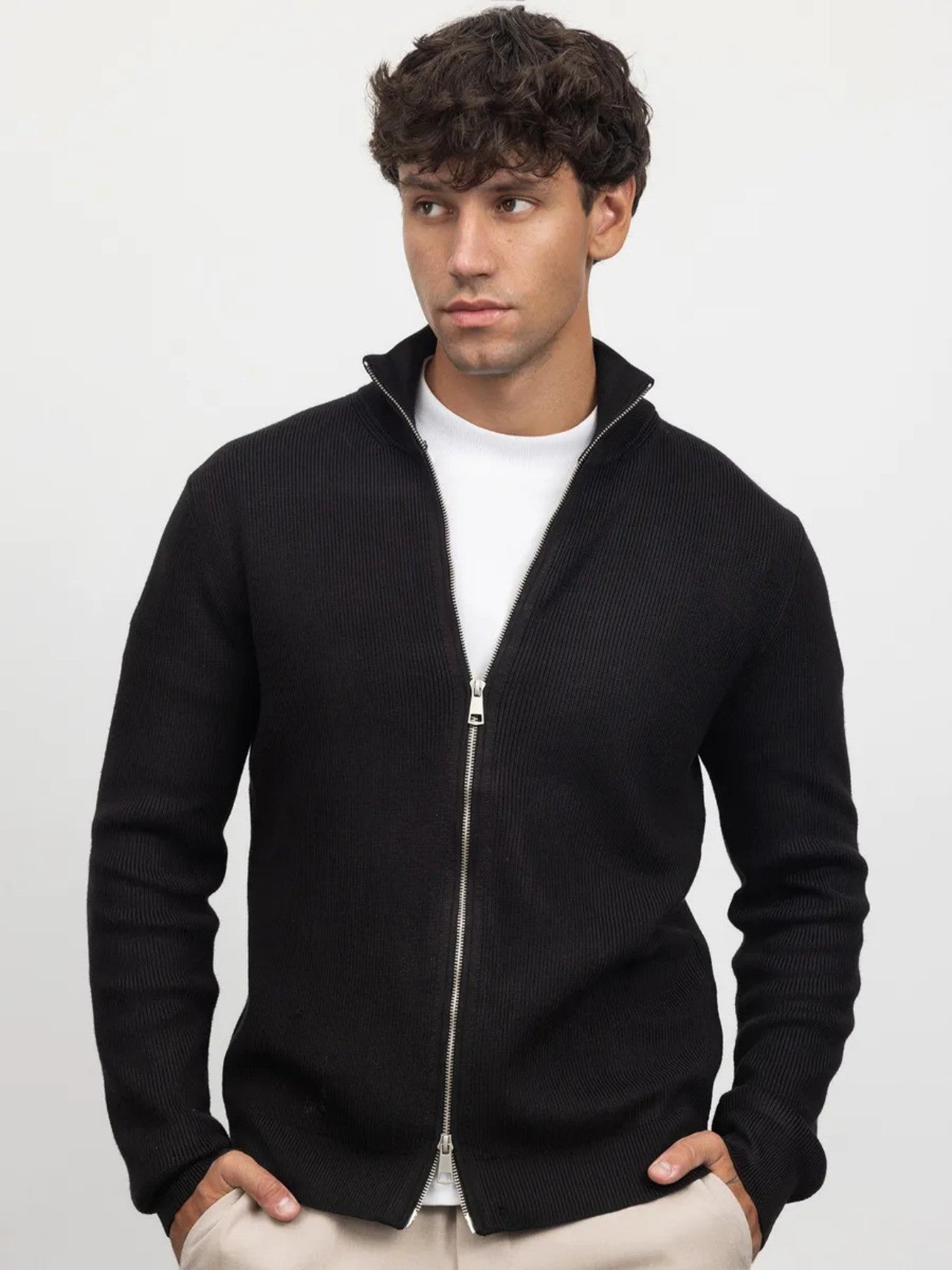 Men's black turtleneck cardigan styled on model