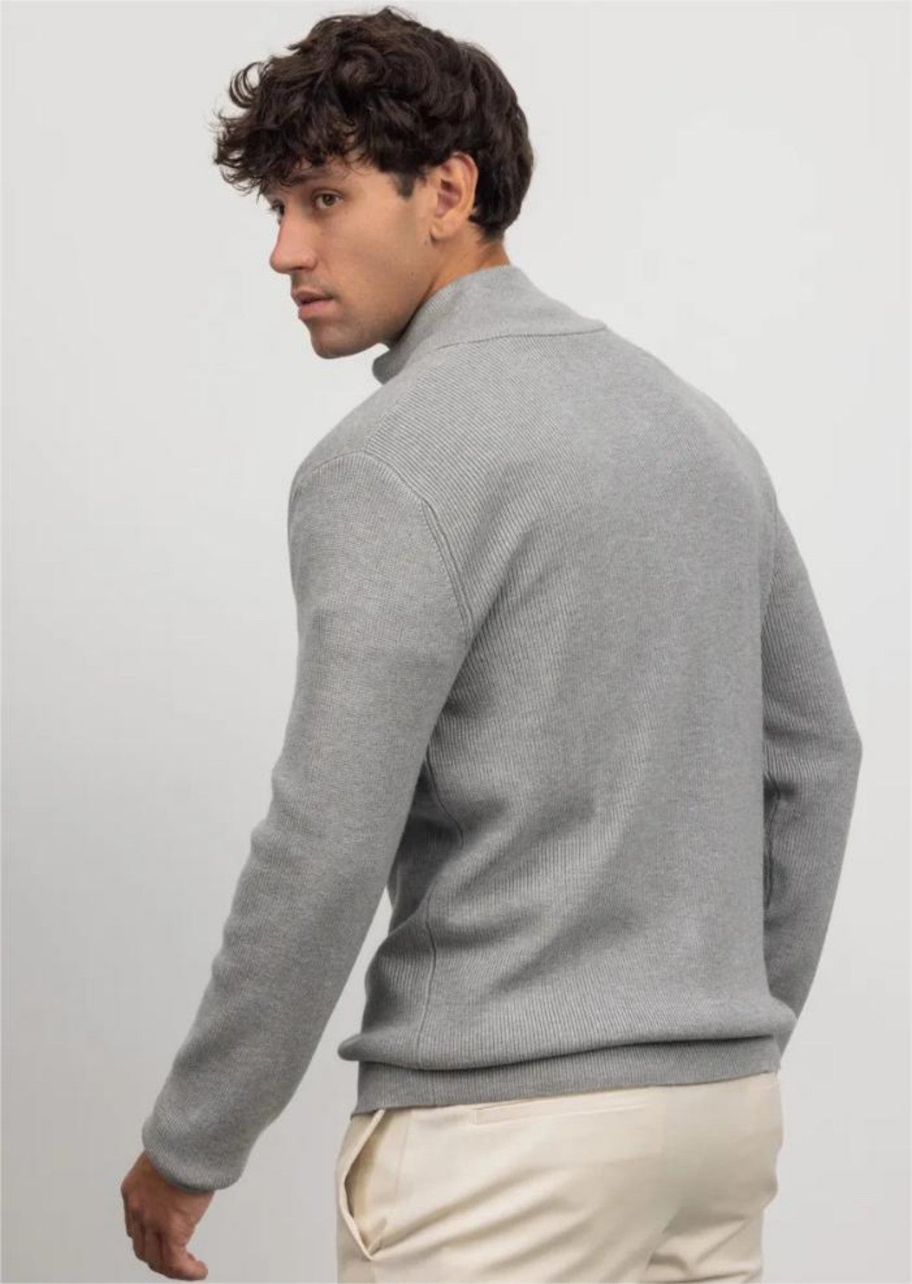 Men's gray turtleneck cardigan back view on model