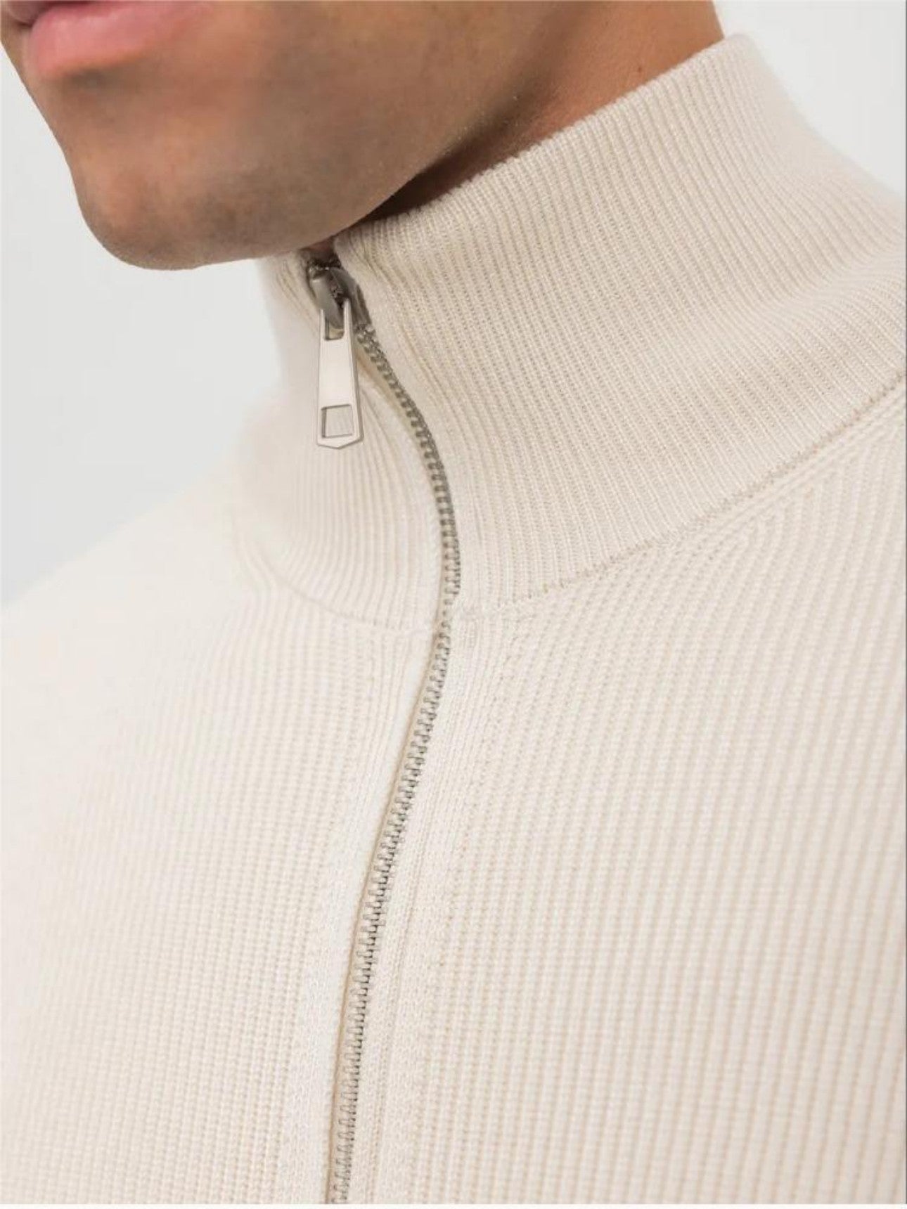 Close-up detail of men's turtleneck cardigan collar