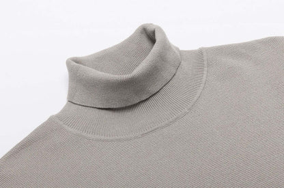Men's Wool Turtleneck OEM - Thick high neck sweater in a soft gray fabric, showcasing its classic design and comfort.