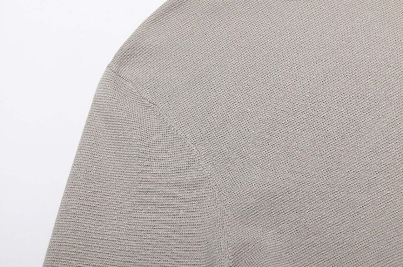 Close-up of the fabric texture of a Men's Wool Turtleneck OEM thick high neck sweater.