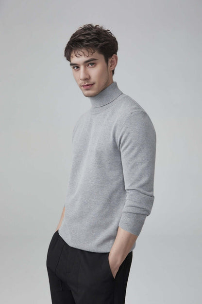 Men's Wool Turtleneck OEM - Model wearing a gray thick wool turtleneck sweater, showcasing versatile style and comfort.
