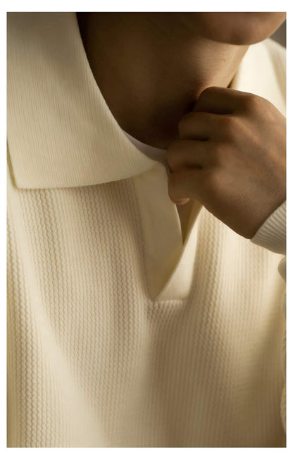 Men's V-Neck Sweater OEM - close-up of a model wearing a cream-colored sweater, showcasing the collar and texture.