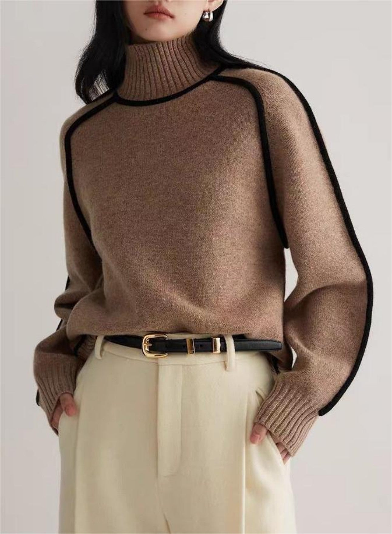 Front view of new sweater in brown on model