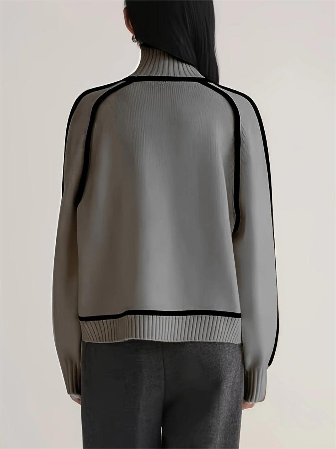 Back view of gray new sweater on woman