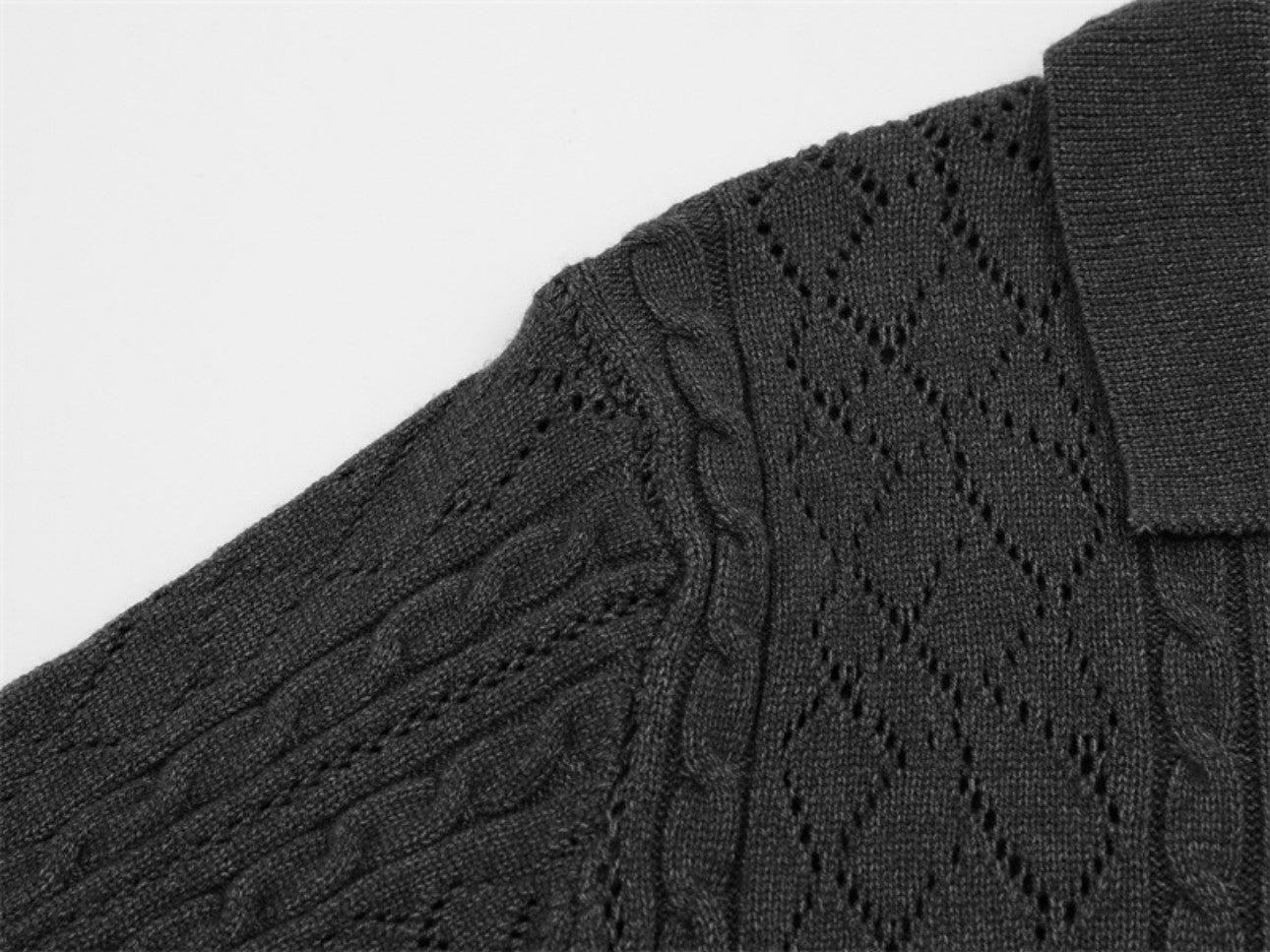 Shoulder seam detail on dark gray polo collar sweater