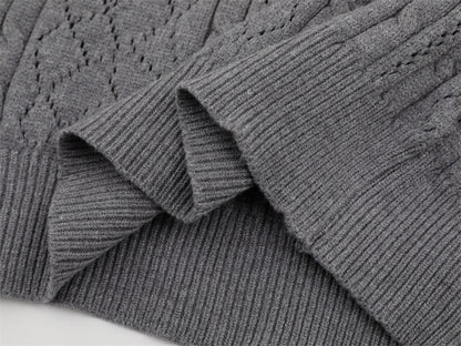 Hem finishing detail on gray polo collar sweater