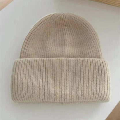 Warm Hat OEM | Women's Rabbit Hair Beanie with Folded Brim in soft beige color on a white surface.
