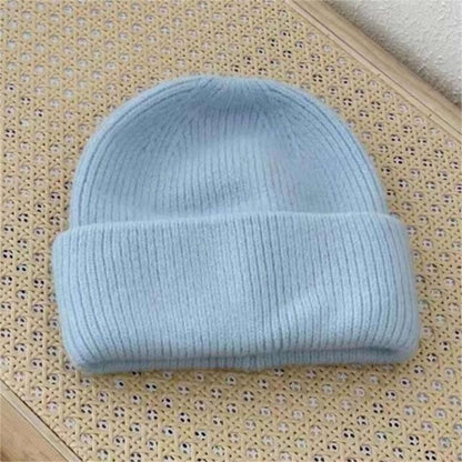 Warm Hat OEM: Women's Rabbit Hair Beanie in light blue with folded brim, perfect for winter fashion.