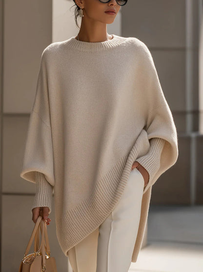 Woman wearing round neck sweater in apricot color, front view
