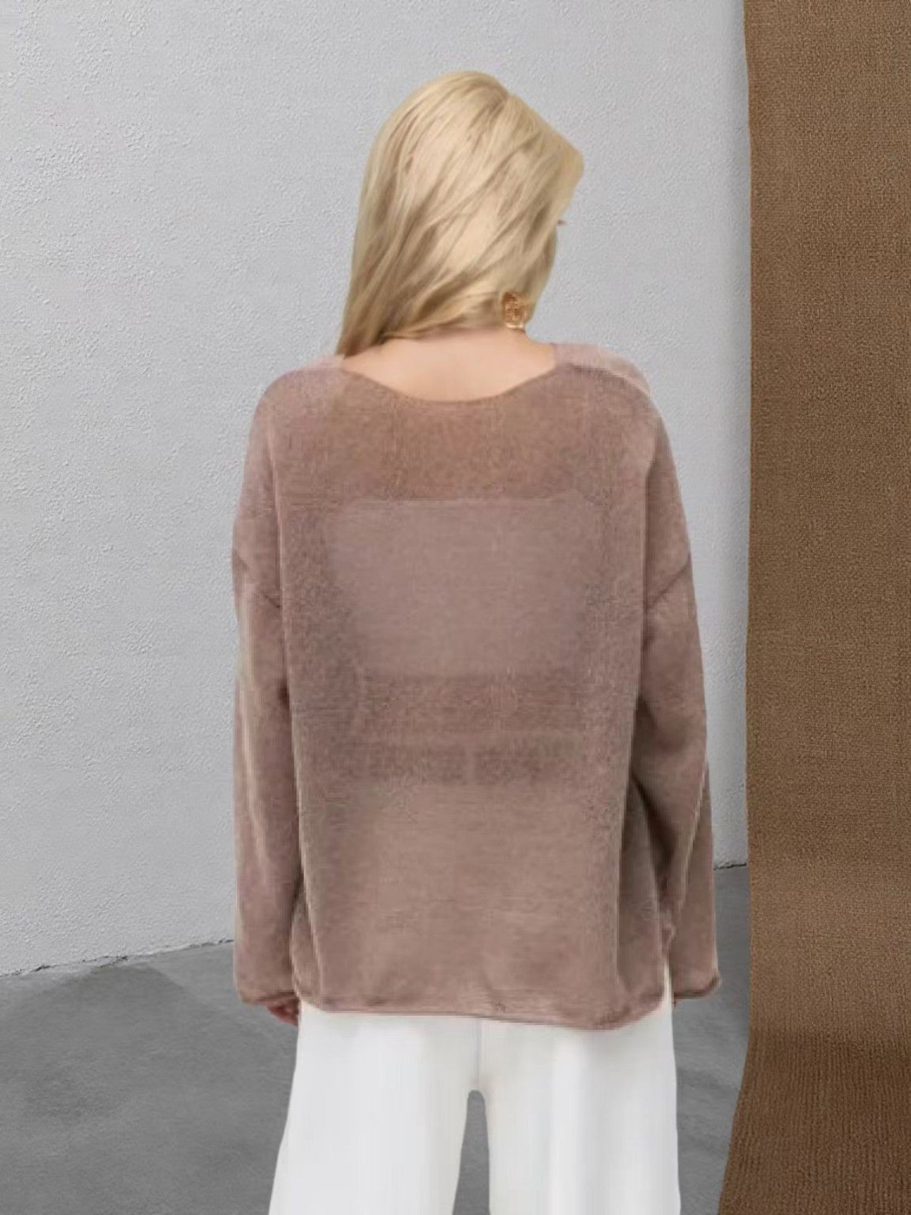 Back view of brown sheer sweater on female model