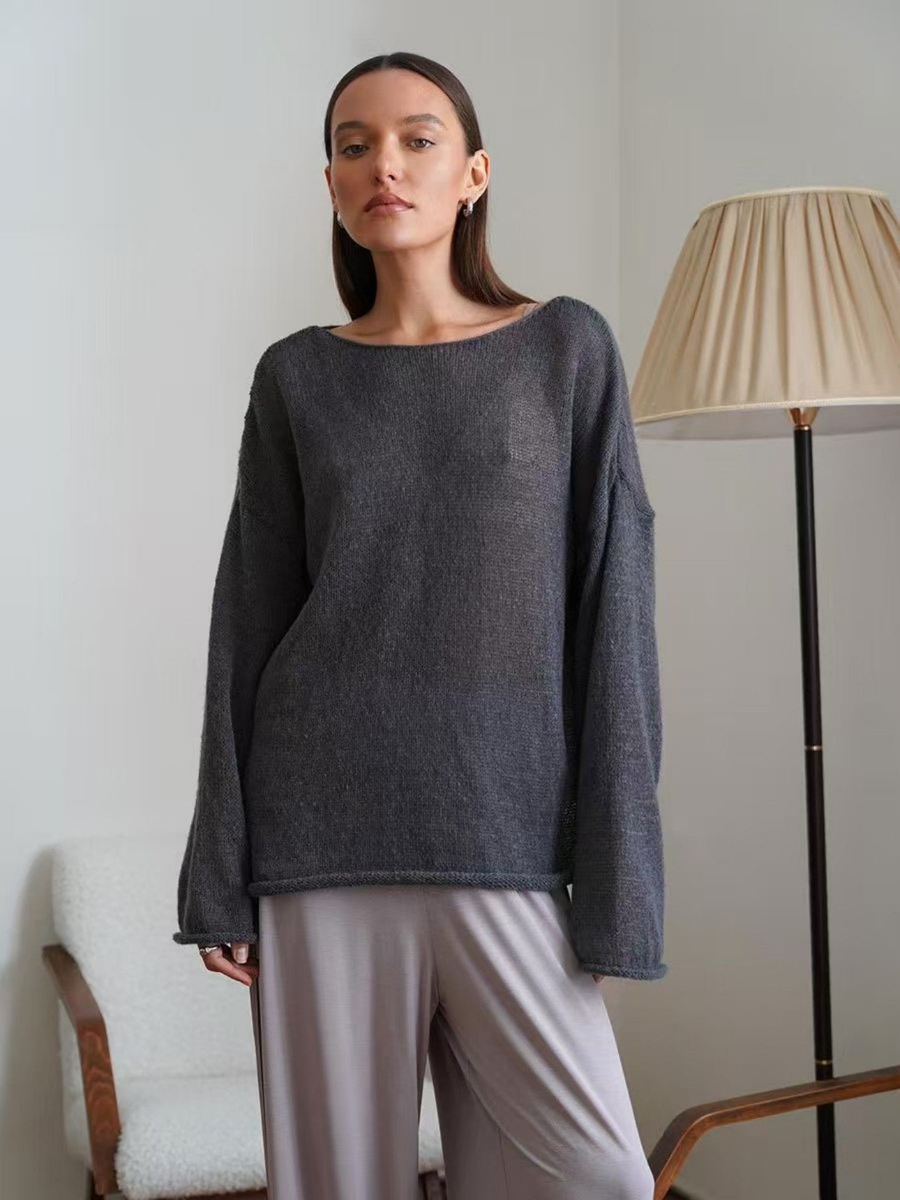 Dark gray sheer sweater, front view showing bell sleeves